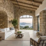 Elegant villa interior with rustic stone walls and modern furniture.